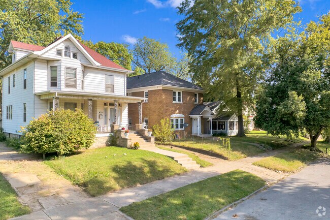 Enjoy the architectural diversity as you explore this row of historic homes in Millikin Home.