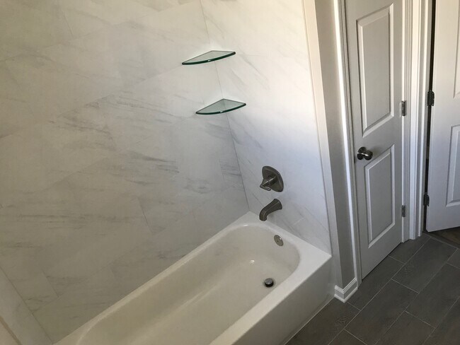 New tub, tile and fixtures