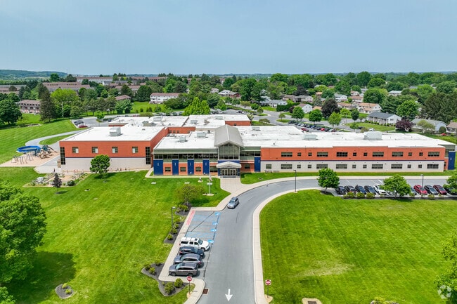 Bucher Elementary School is surrounded by lush greenery and residential neighborhoods.