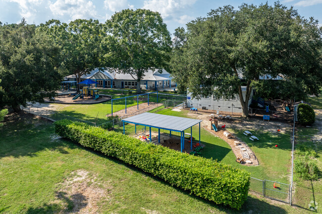 Students enjoy the playground at Millhopper Montessori School.