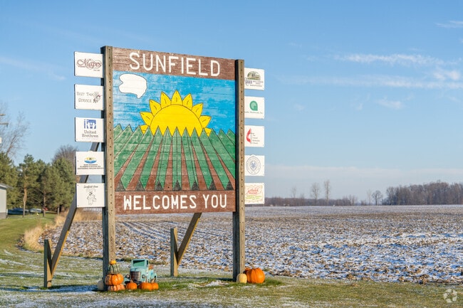 The sign welcomes drivers into Sunfield.