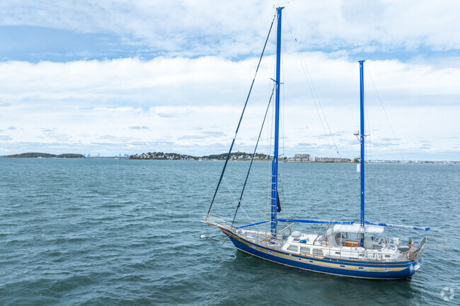 A sailboat is moored off the shores of Strawberry Hill.