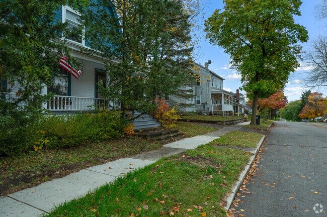 A view down a quiet Manchester street highlighting some of the older homes in the community.