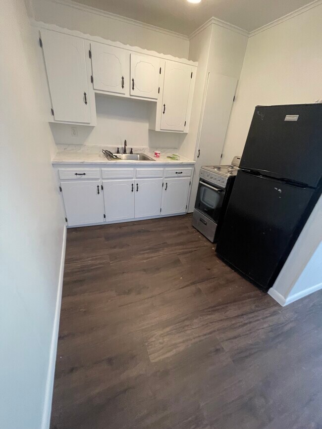 New flooring and paint and kitchen countertops! Refrigerator provided!
