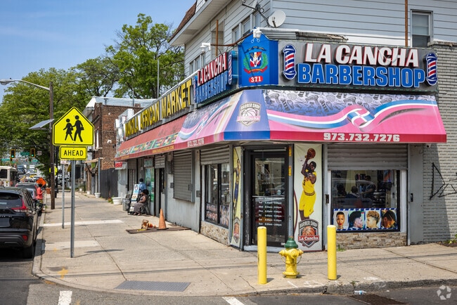 The vivid La Cancha Barbershop
situated on the corner Lyons Ave and Hobson St in Weequahic, NJ.