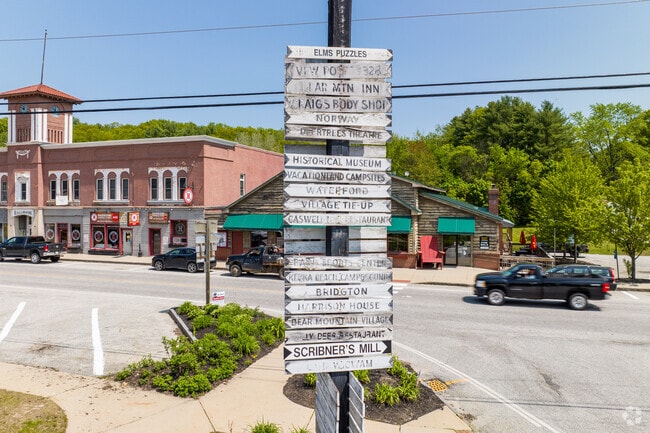 Main Street Harrison offers year‑round conveniences with lakeside character.