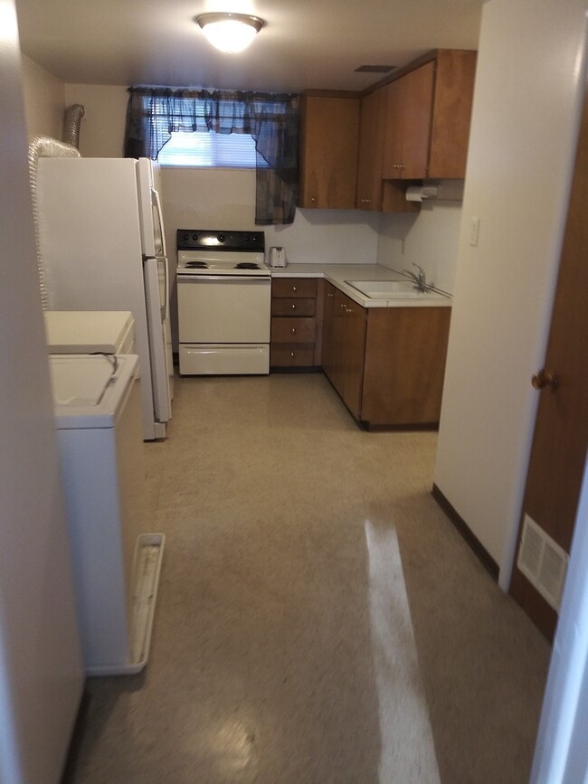Looking into Kitchen. Washer/dryer on left