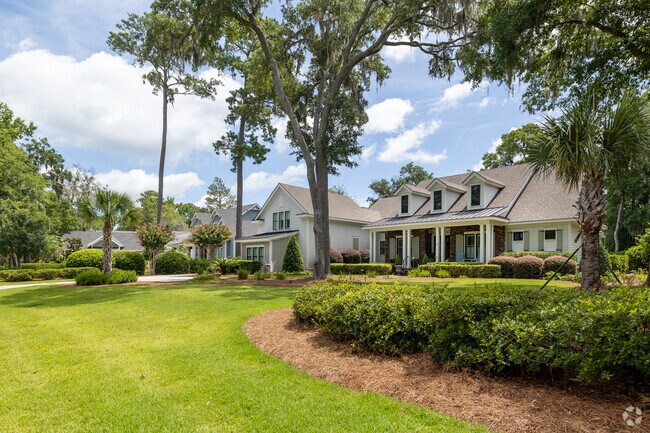 Lowcountry-style homes with immaculate landscaping line the streets of Colleton River.
