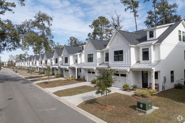 Many homes are designed with classic southern charm and brick or wood facades.