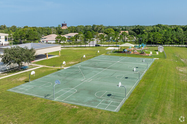 Students enjoy outdoor play on the sports courts at Gulf Highlands Elementary School.