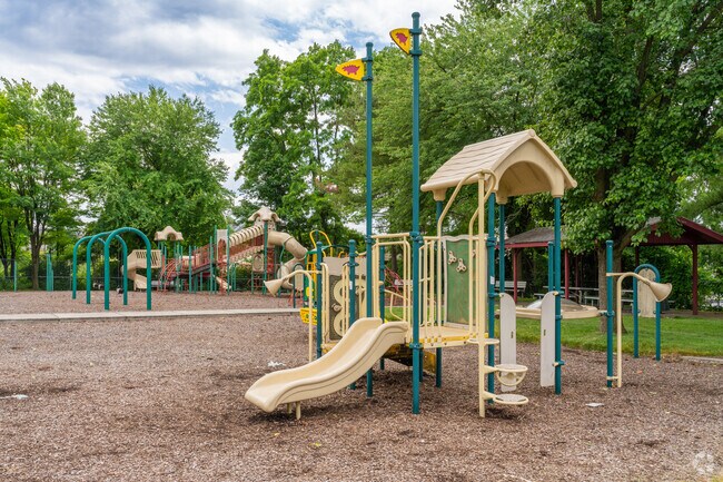 Allencrest Playground has fun play structures for children near Highland Park.