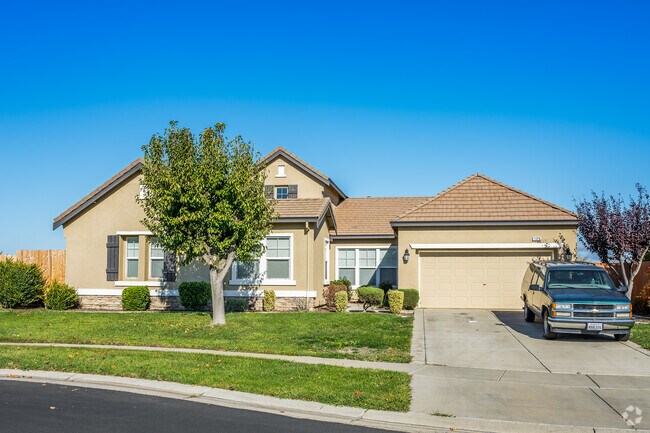 This home, with a tile roof and stucco siding is part of a newer development in Olivehurst.