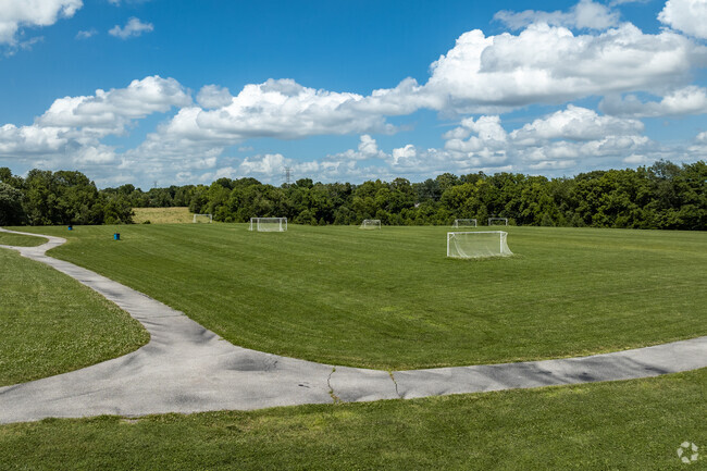 Harrison Elementary School campus includes a large open field set up for soccer.