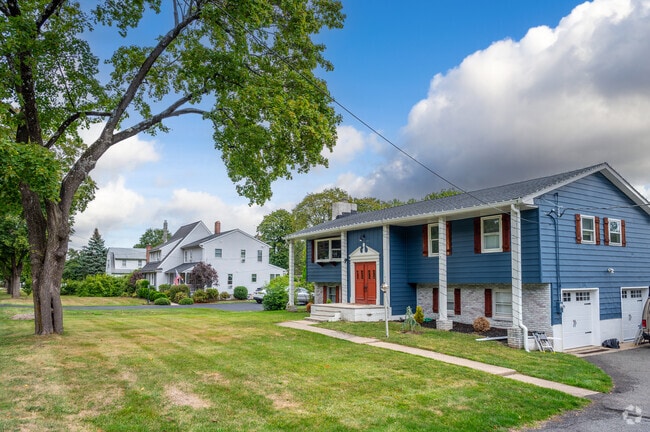 Colorful homes in Roxbury blend architectural styles and include two-car garages.