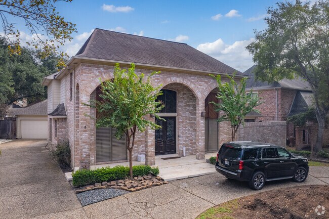 Stately homes with brick exteriors offer a welcoming atmosphere, in Hilshire Village.
