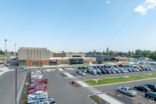 Cheney High School has a large parking lot in front of the school for its students.