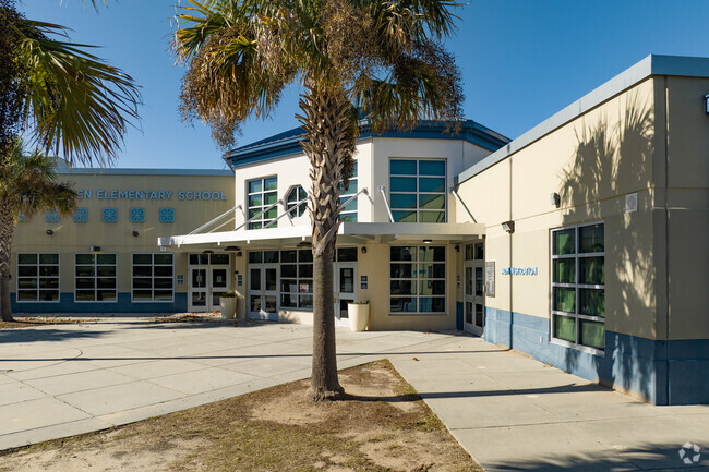 Gadsden Elementary School is shaded by palm trees.