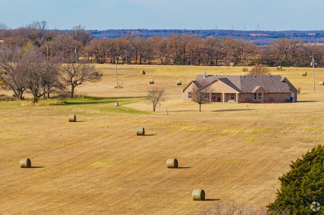 Aerial view of a ranch house with big yard in the Meeker neighborhood.
