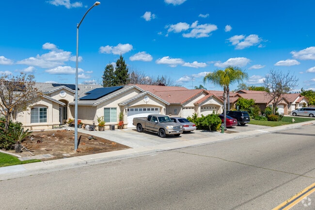 Several Mediterranean homes have solar panels and palm trees in Kingsburg.