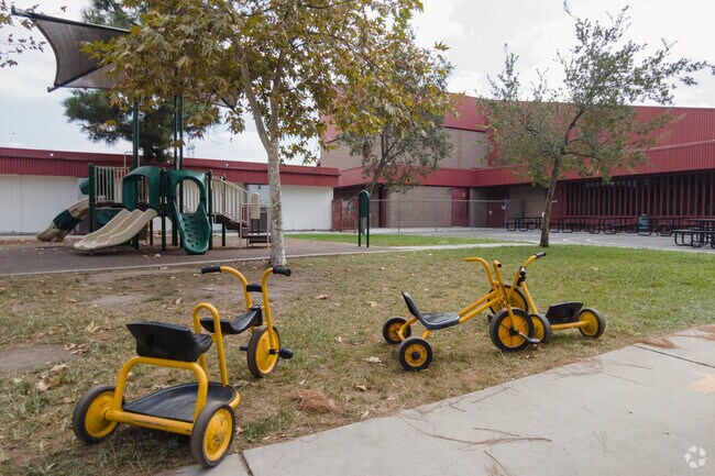 Playground equipment and tricycles, allow for rigorous activity during recess.