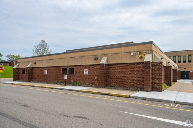 J. H. Brooks Elementary School has a student drop off section on the side of the school.