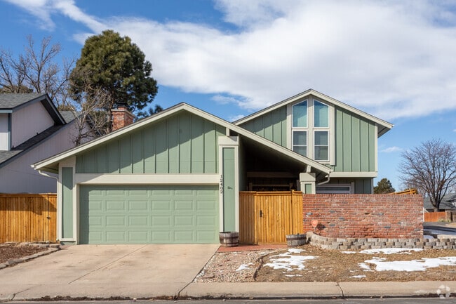 Dam East/West features suburban homes with attached two-car garages and fenced yards.