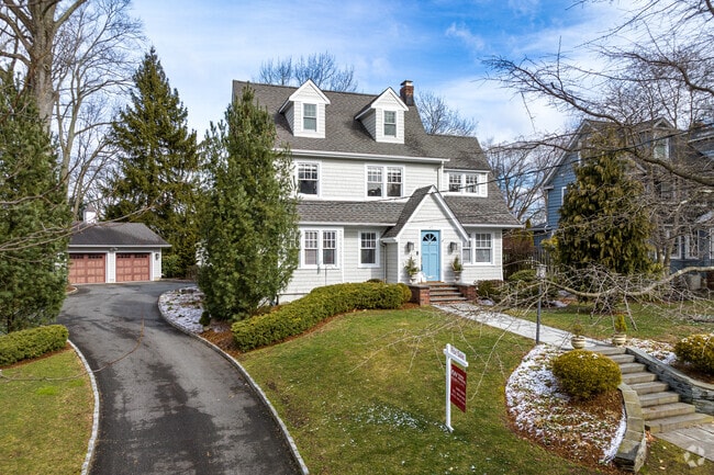 A New Traditional style-home situated in the quiet neighborhood of Summit, NJ.