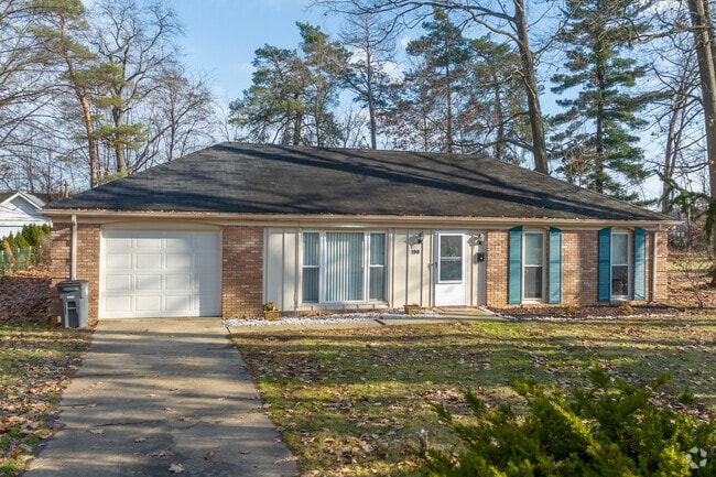 Ranch style home with a tidy lawn in Oberlin.