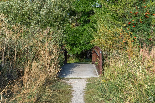 Take a stroll across the footbridge at Langohr Gardens Park by Bozeman Creek.