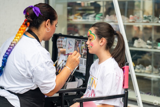 An artist creates beautiful face-paint designs at the Latin (sub)URBAN Art Walk in Naperville.