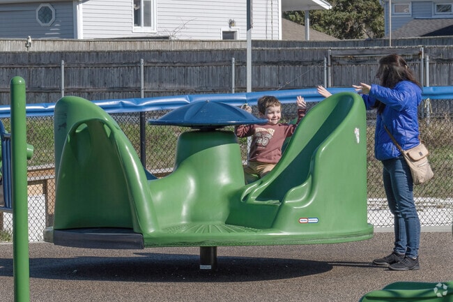 Take a spin on the playground equipment by the beach in Ocean Grove.