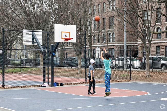 Residents enjoying a beautiful day at Devoe Park in the University Heights community.