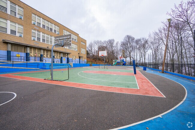 Bradley Elementary's schoolyard sits behind the school building in Harbor View-Orient Heights.