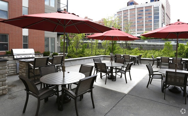 Two outdoor entertainment & grilling areas