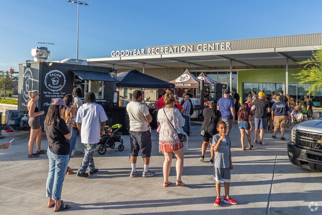 Food trucks serving mouthwatering food at the Goodyear Food Truck Friday in Wildflower Ranch.