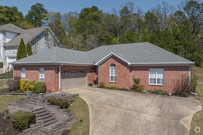 A light red brick ranch-style with stone steps in the Rock Creek neighborhood.