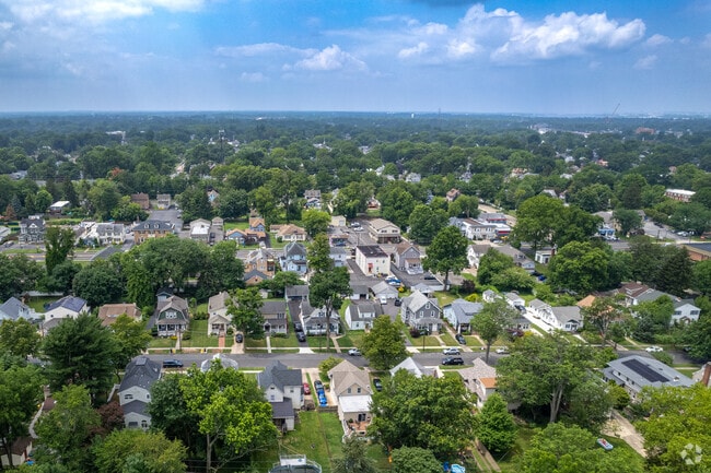 Audubon is a peaceful area surrounded by trees and greenery.