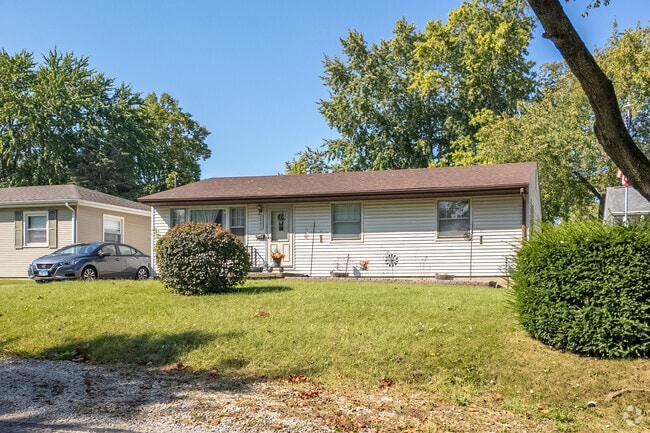 A modest Ravina Park ranch style home glistens in the sun.