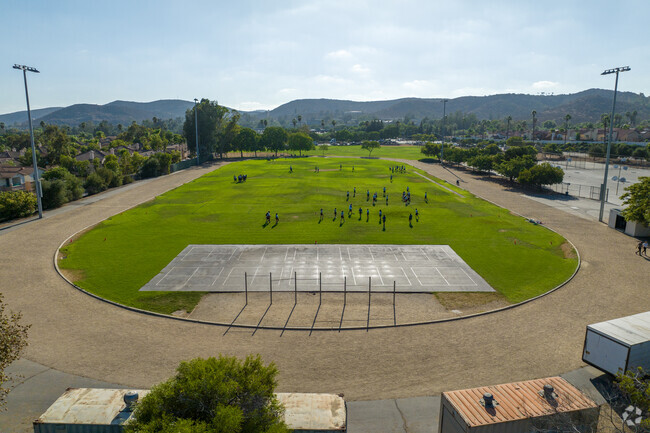 students playing in the track and field.