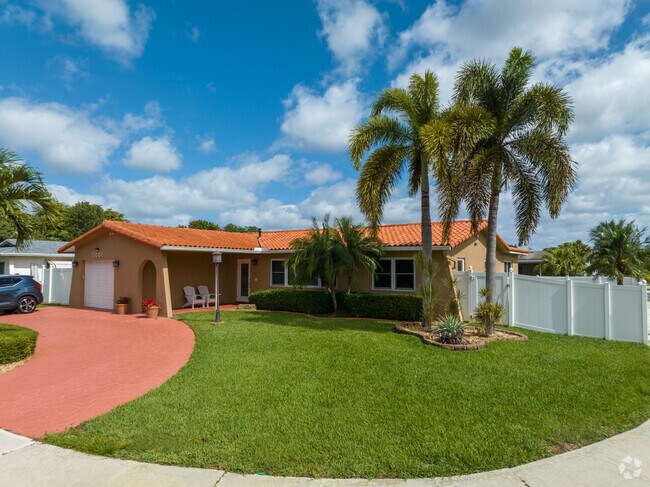 Colorful character abounds in this charming Pembroke Lakes South ranch-style home.
