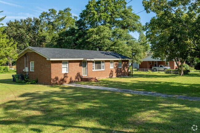 Many of the homes in Seagate have big yards with large trees.