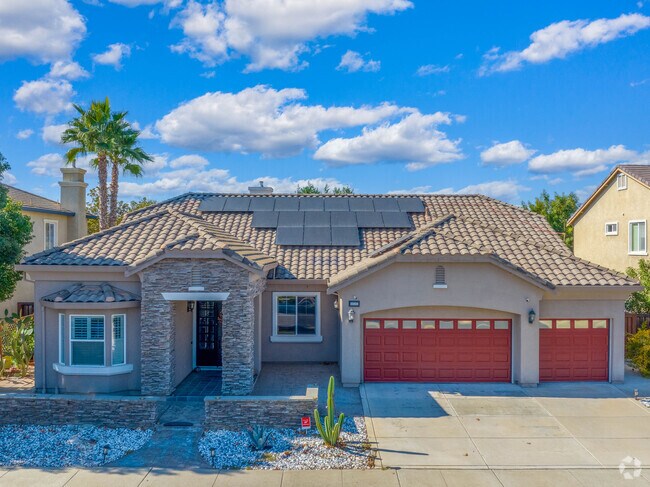 Many homes in Sand Creek have multi-car garages and big front windows.