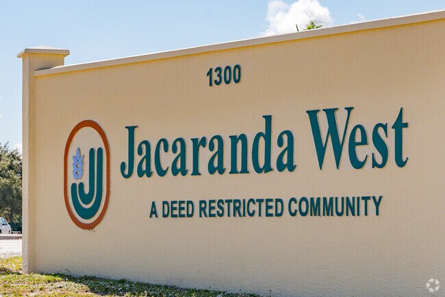 Signs at the Jacaranda West entrance welcome residents and guests to the community.