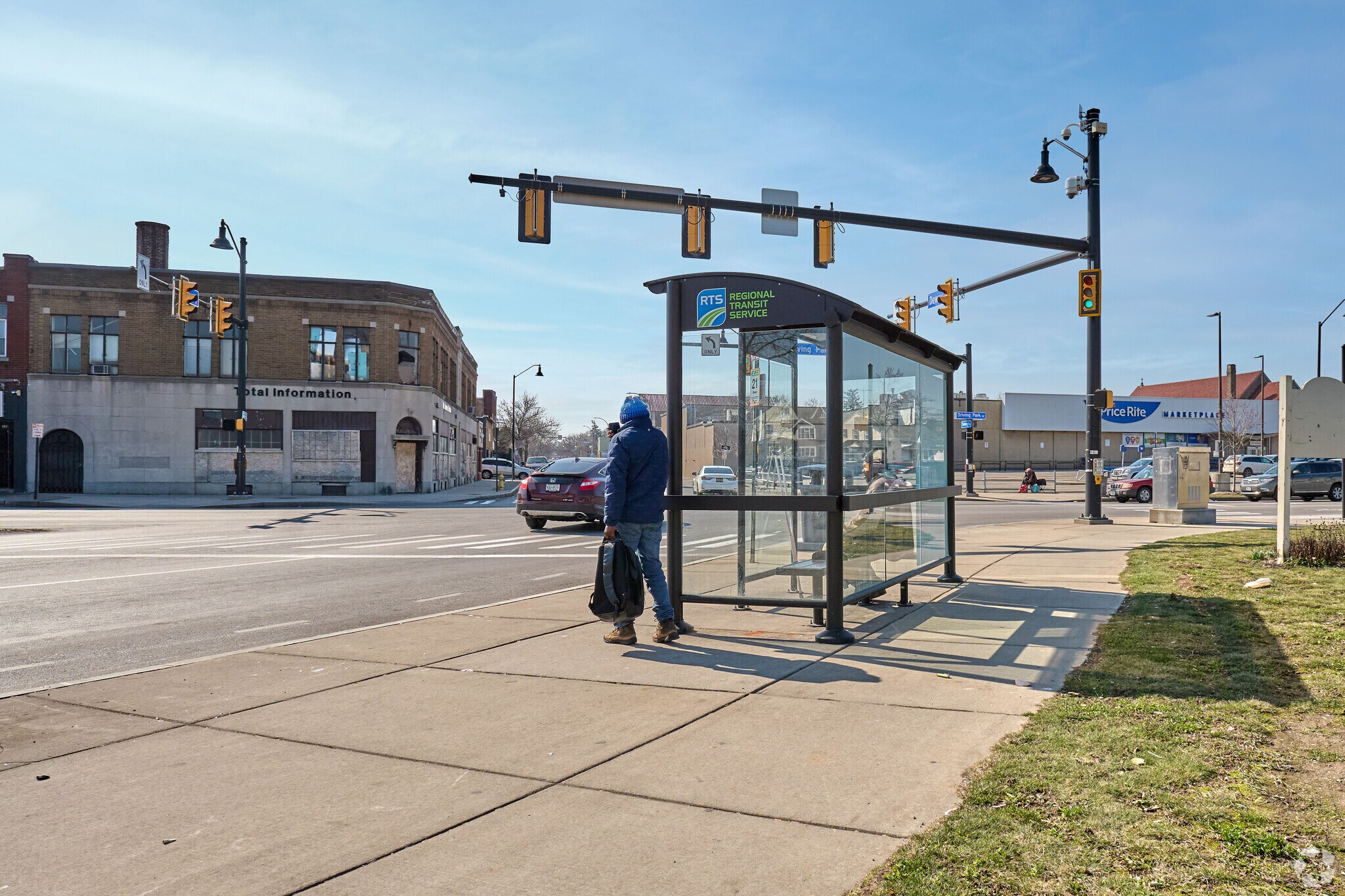 Edgerton residents wait for the RTS bus on Dewey Avenue.