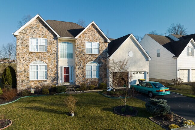 Large contemporary homes with two-car garages are dispersed throughout the neighborhood.