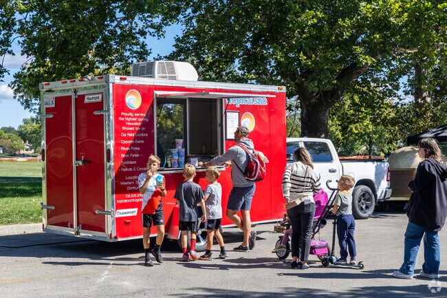 Families enjoy a frozen treat during the annual Harvest Fest event in Western Springs.