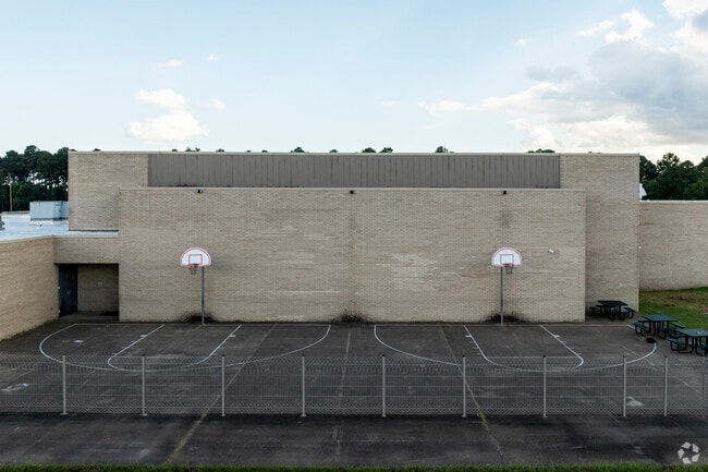 Students at Crosby Elementary School an play a game of basketball during recess.