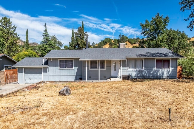 This ranch-style home has a 1-car garage and normal siding in Jones Valley.