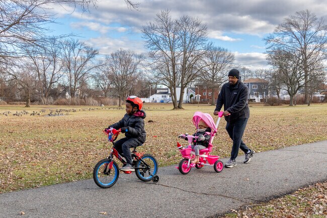 A family strolls with their kids at Peach Orchard Park in Linden, enjoying the day.