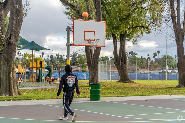 Challenge friends to a game of basketball at Villegas Park.